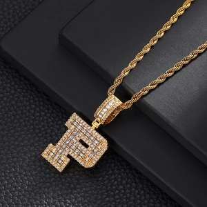 Detailed macro view of a gold-plated letter P pendant set with sparkling zircon stones