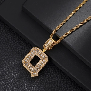 Detailed macro view of the gold-plated letter Q pendant with zircon stones and rope chain