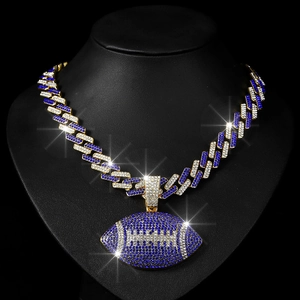 Detail of hip hop Cuban link chain with blue white rhinestones and rugby pendant