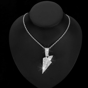 Close-up of hip-hop silver lightning bolt pendant with pavé crystals on rope chain