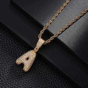 Iced out gold bubble letter A pendant with cubic zirconia and twisted rope chain