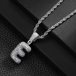 Close-up of hip hop letter E pendant with cubic zirconia micro-pave on silver rope chain
