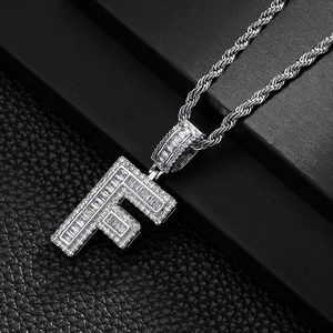 Close-up of hip-hop square letter F pendant with baguette diamonds and rope chain