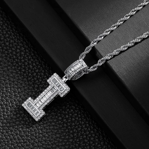 Macro shot of silver hip hop square letter I pendant with sparkling cubic zirconia inlay
