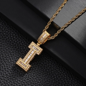 Macro detail of gold-plated letter I pendant with pave-set cubic zirconia on rope chain
