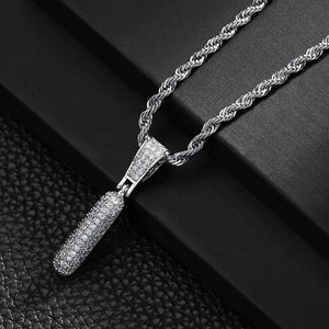 Close-up of hip-hop silver capsule pendant with micro-pave cubic zirconia on rope chain