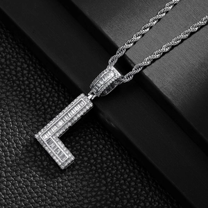 Detailed close-up of a silver letter L pendant with micro-pave cubic zirconia on rope chain