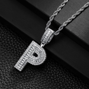 Macro detail of silver hip hop letter P pendant with micro-paved cubic zirconia
