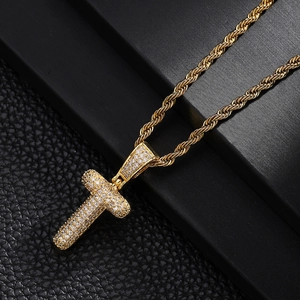 Close-up of hip-hop style T-letter pendant necklace with zircons on twisted rope chain
