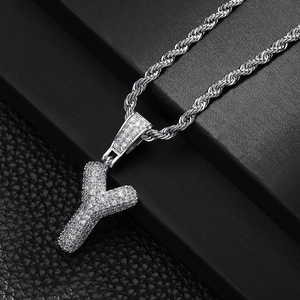 Macro shot of silver hip-hop letter Y pendant with micro-pave zircons on twist rope chain