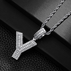 Macro shot of a hip hop Y-letter pendant with baguette-cut and micro-pave zircons