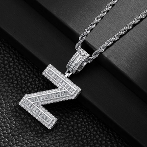 Detailed macro view of silver hip hop square letter Z pendant with iced out cubic zirconia