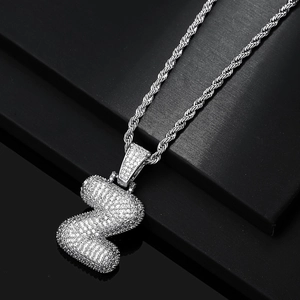Close-up of hip hop letter Z pendant with silver rope chain and sparkling cubic zirconia stones