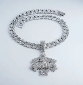 Macro view of silver iced out Get Money pendant with pave cubic zirconia on Cuban chain