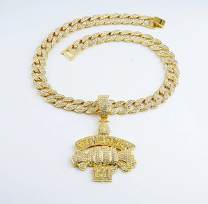 Detail view of gold Cuban chain with GET MONEY 1ST iced out pendant for hip hop style
