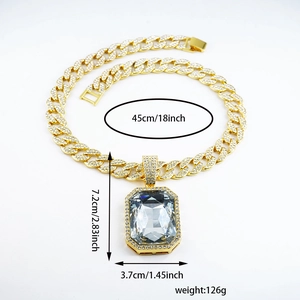 Detail view of iced out Cuban link chain with square crystal pendant showing 7.2cm dimensions