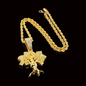Macro shot of hip hop money tree pendant with $100 gold bars and twisted rope chain