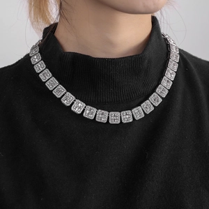 Silver cuban link chain for men with pavé set crystals on a black turtleneck sweater