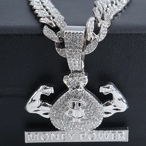 Detail of hip hop iced out money bag pendant with dollar sign and money power engraving
