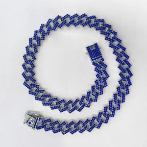 Detailed view of a 15mm wide blue rhinestone iced out cuban link chain necklace for men.