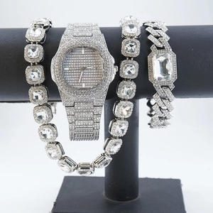 Detailed view of silver crystal watch and bracelet set on black jewelry T-bar display