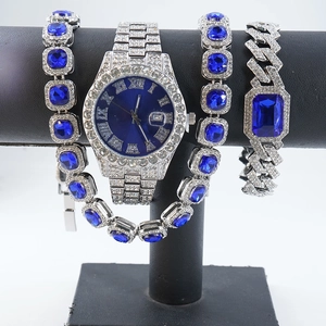 Detail of silver iced-out watch and hip-hop bracelet set with deep blue square stones