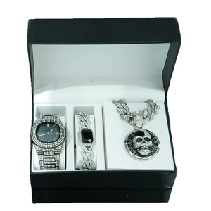 Hip hop jewelry set featuring skull pendant Cuban necklace, iced-out watch and bracelet
