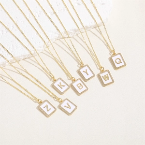 Golden alphabet pendant necklaces with white enamel and cubic zirconia border set