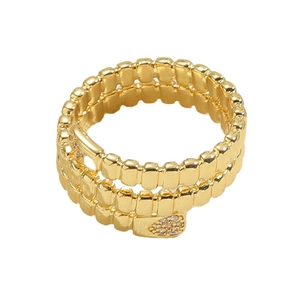 Golden multi-layer spiral ring featuring a sparkling heart-shaped zircon centerpiece
