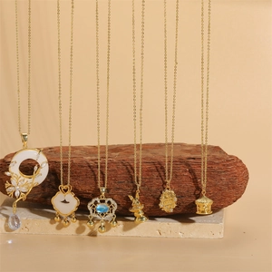 Vintage style gold necklaces with pearl lock, shell pendants, and zircon tassels