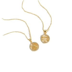 Elegant 14K gold plated zodiac necklaces featuring Libra and Scorpio pendants with cubic zirconia