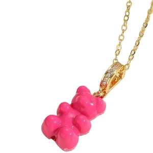 Pink resin gummy bear pendant necklace with gold chain and cubic zirconia accents
