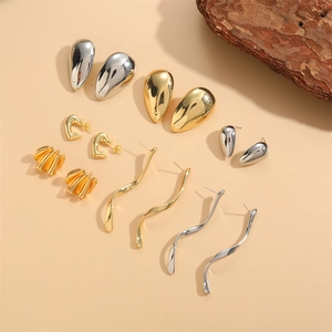 Set of polished gold and silver earrings with waterdrop, heart and wavy fan designs