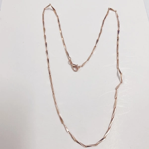 Detail of rose gold twisted geometric link necklace with a secure lobster clasp