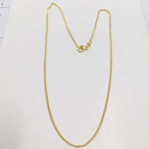 Detailed close-up of gold-plated wheat chain featuring a secure lobster claw clasp