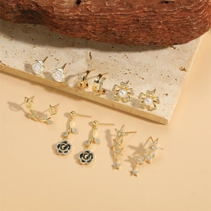 Elegant 6-pair gold plated earring set featuring tulip, rose, pearl and star motifs