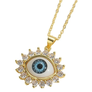 Exaggerated evil eye zircon pendant necklace with blue iris and golden radiation frame