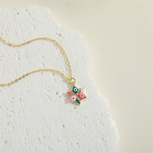 Golden necklace with a hexagram star pendant featuring colorful evil eye enamel design