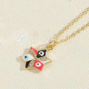Macro shot of gold star pendant with evil eye motif and sparkling crystals