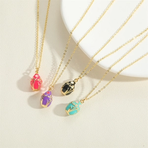 Vintage oval enamel egg pendants in four colors on 14K gold plated O-link necklaces