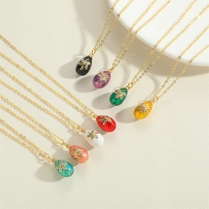 French vintage enamel egg pendant necklace with gold floral patterns and zircon