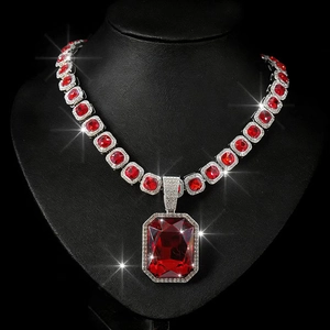 Silver Cuban chain necklace with red square-cut gemstones and a large emerald-cut pendant