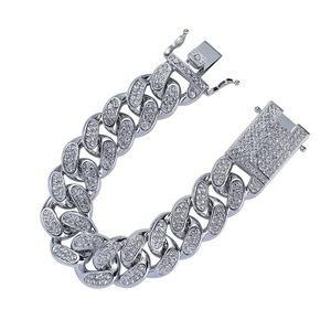 Macro shot of 20mm silver Cuban link bracelet with iced out crystals and square clasp