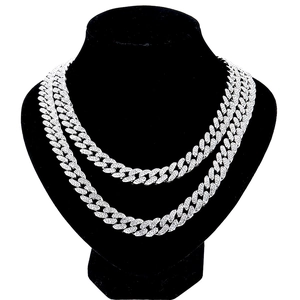 Close-up of double-layered silver iced-out Cuban link necklace with white zircon stones