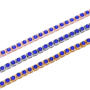 Trois bracelets tennis hip-hop en or rose, argent et or avec des pierres de zircon bleu