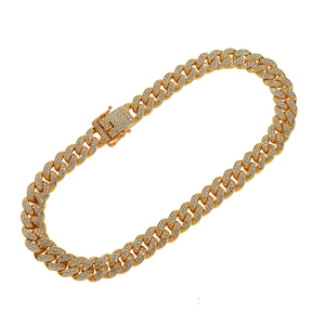 Close-up of gold cuban link bracelet with dense pavé-set sparkling crystals and secure clasp