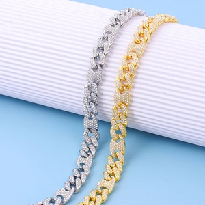 Detailed view of hip hop Cuban link chain with coffee bean accents and crystal pavé