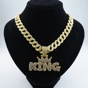Hip-hop gold plated KING crown pendant with iced out rhinestones on a chunky Cuban link chain