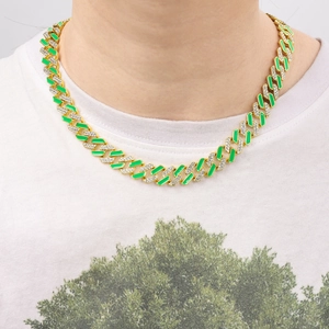 Close-up of hip hop Cuban link chain with green enamel and pavé-set rhinestones