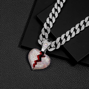 Iced out hip hop Cuban chain with broken heart pendant featuring red crack and silver rhinestones